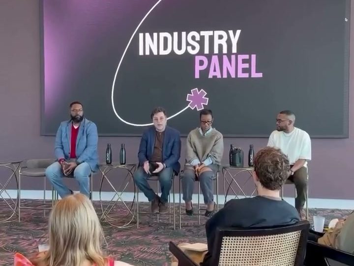Panelists on stage at a FLUX industry panel